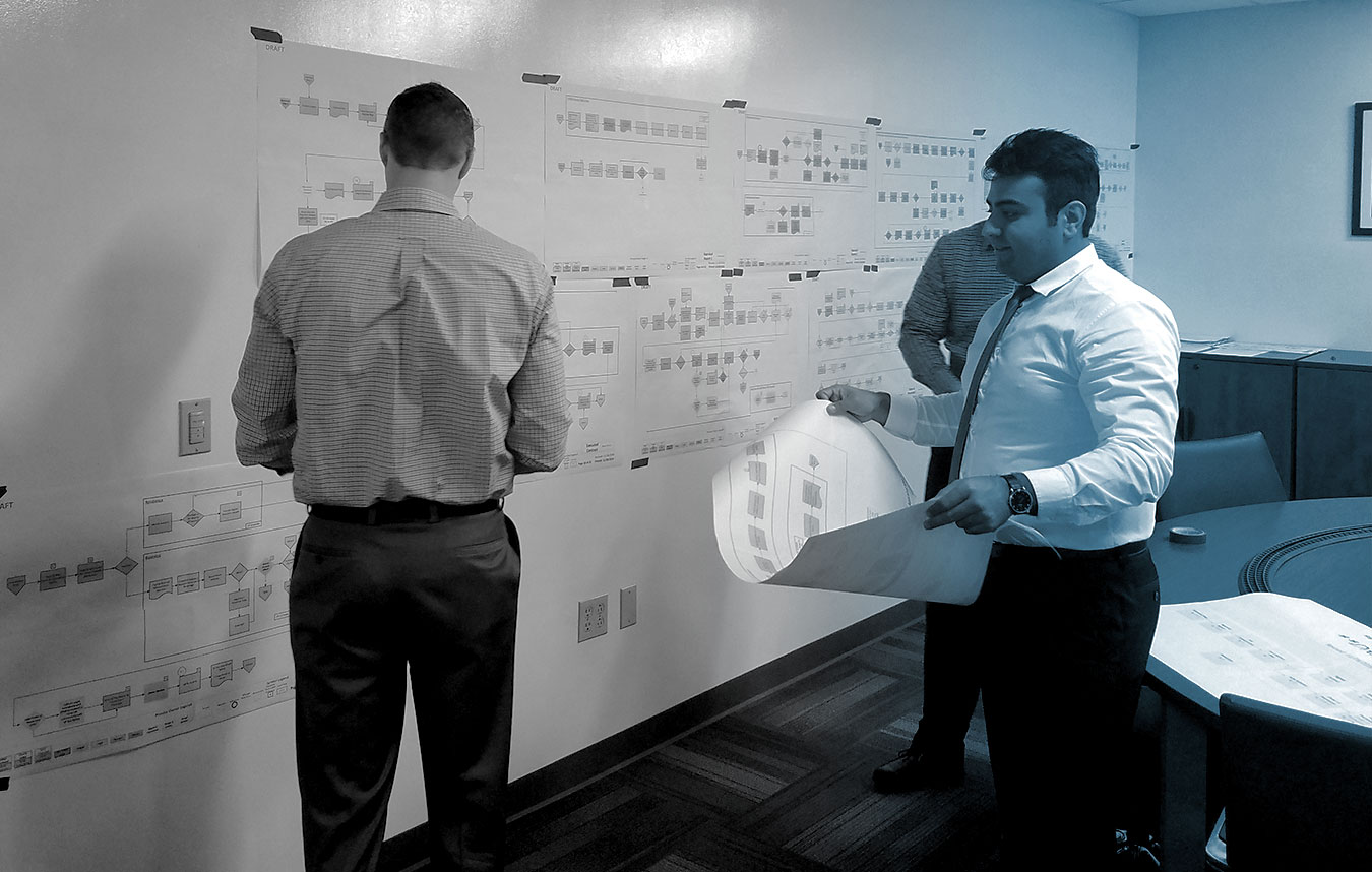 Alta Vista employees conduct value stream mapping for business process improvement on the DEA project