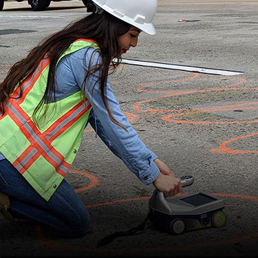 An employee using ground-penetrating radar (GPR). Click for more info on our local agency work